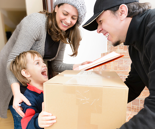 Child receives a care package from Christmas / Winter Essentials Program