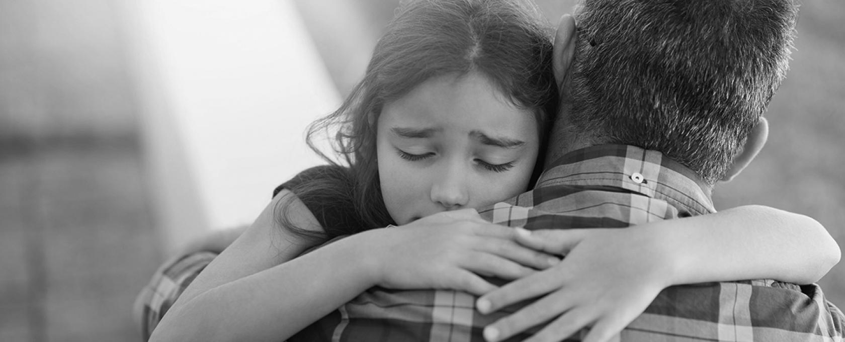 Father and daughter hug