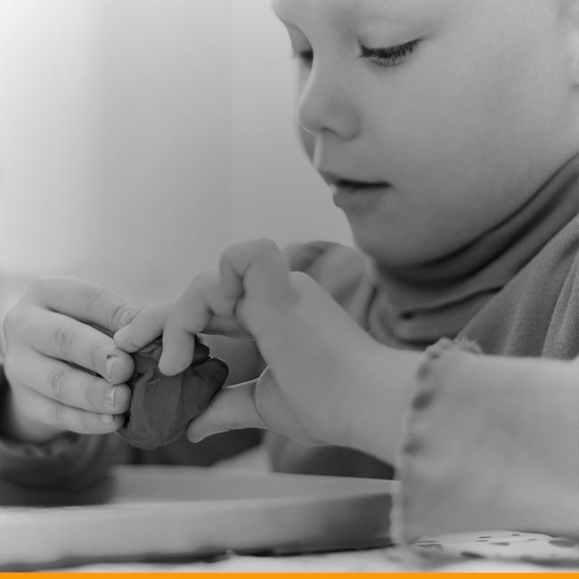 A child plays with play dough.